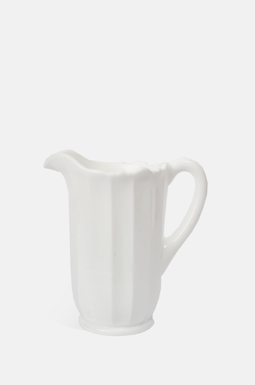 Mosser Glass moulded milk white panelled pitcher with irregular scalloped rim.