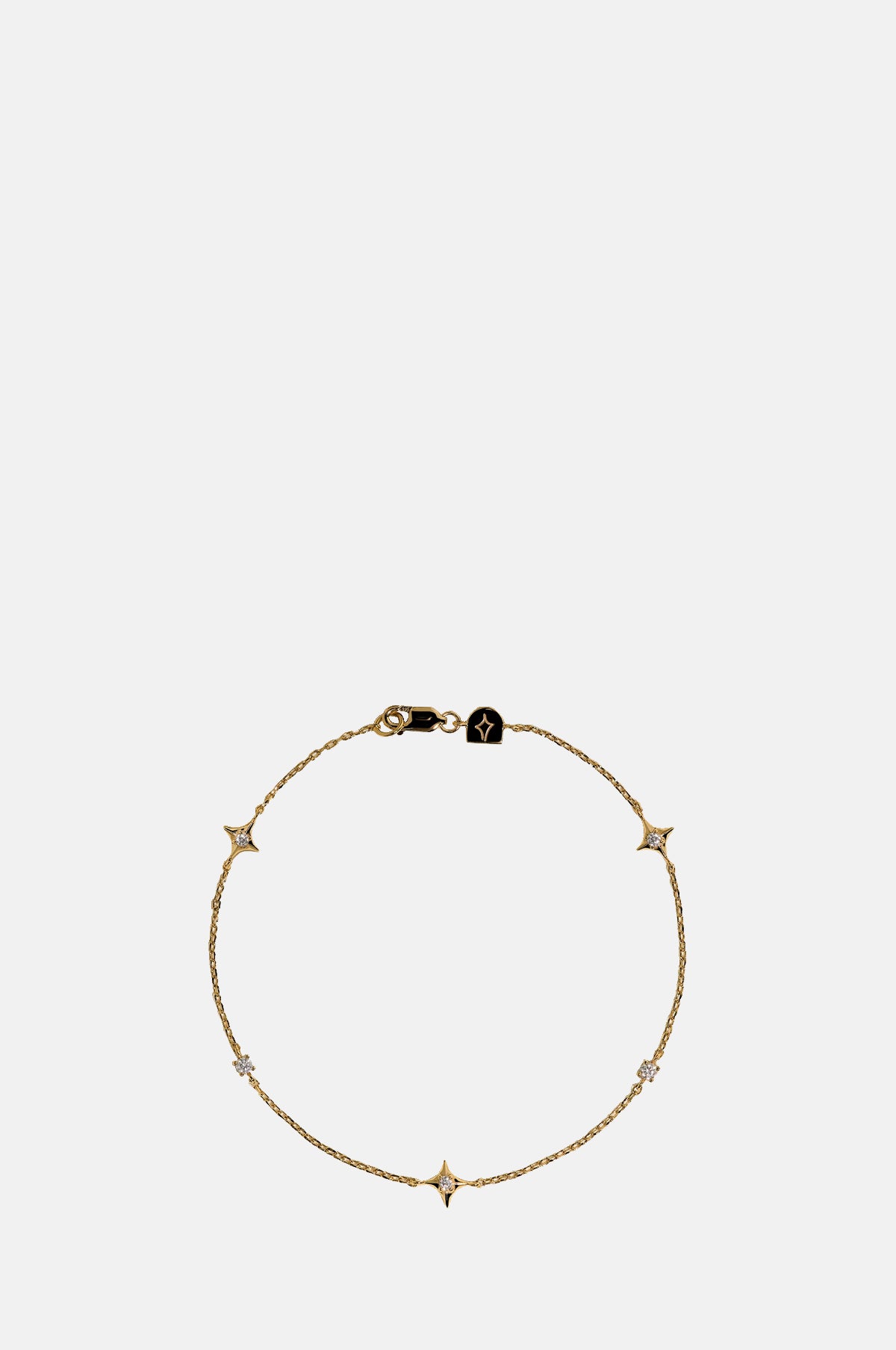 Astrid & Miyu Cosmic Star Charm Bracelet in Gold.
