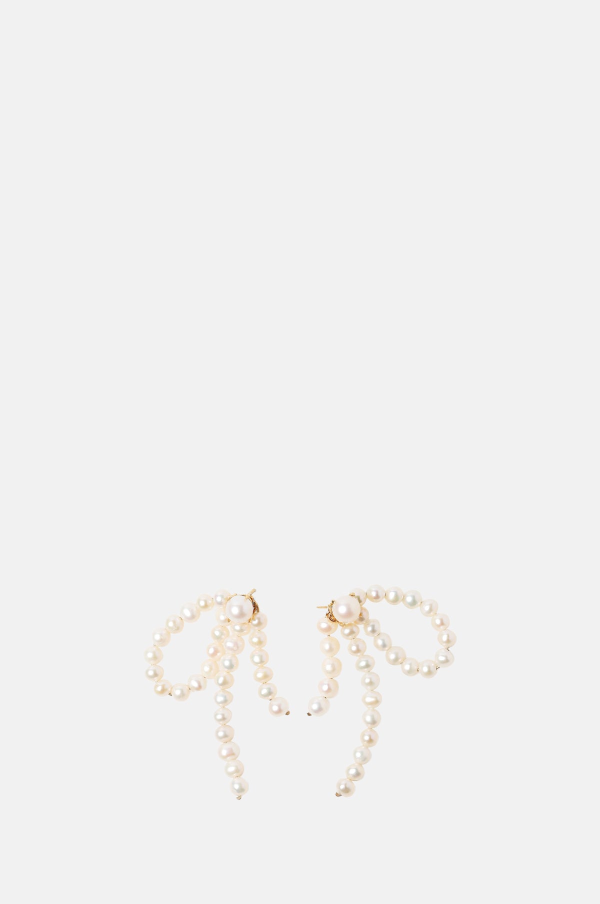 Beatriz Palacios Half Bow Pearl Earrings.
