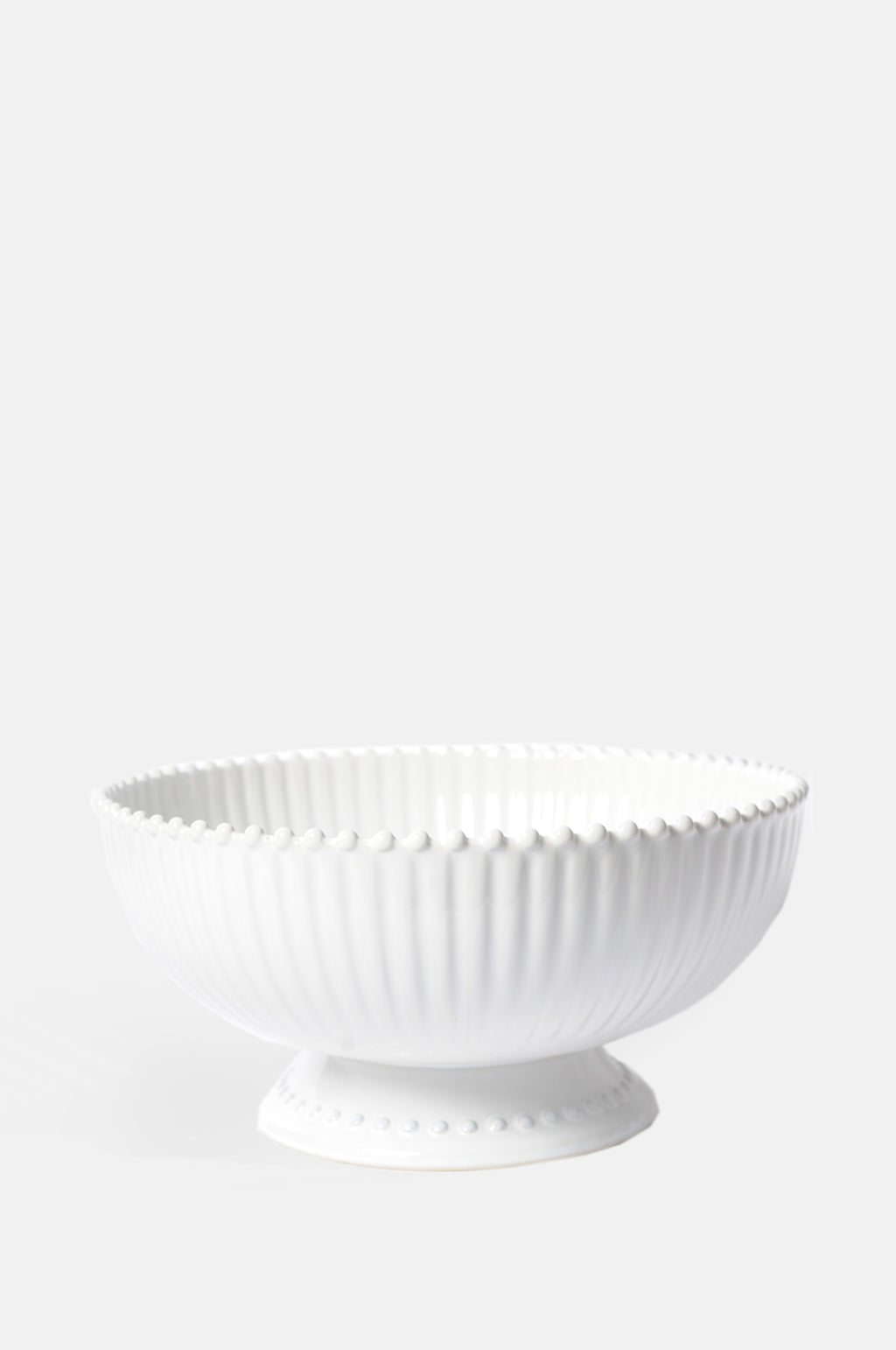 Costa Nova pearl white centrepiece serving bowl with foot and ribbed detailing.