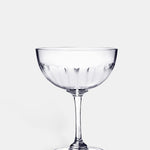 The Vintage List lens champagne saucer with band of connecting oval detailing.