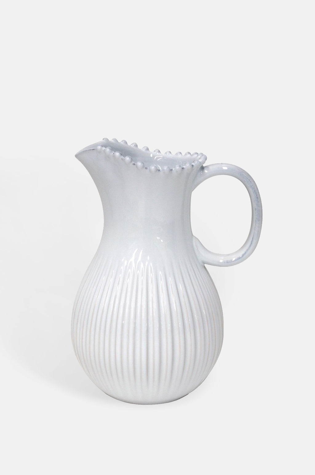 Costa Nova pearl white pitcher with pearl edging and ribbed detailing.